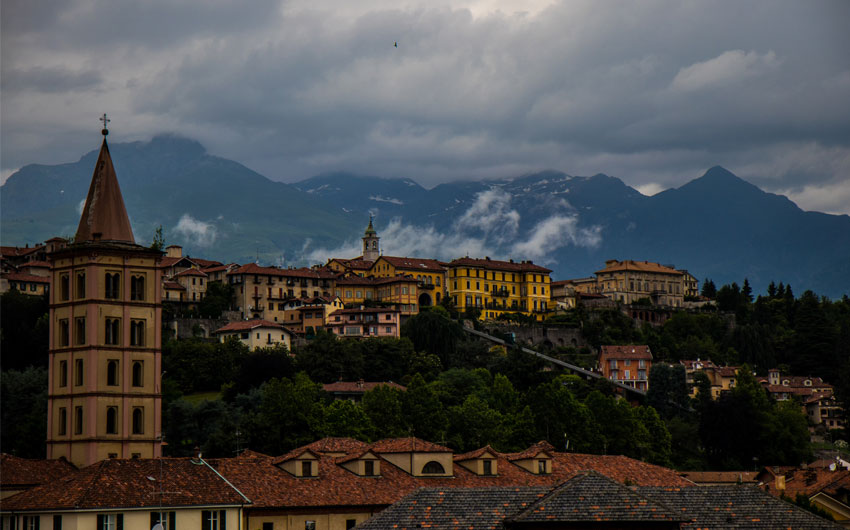 Beautiful old buildings and majestic mountains in Biella