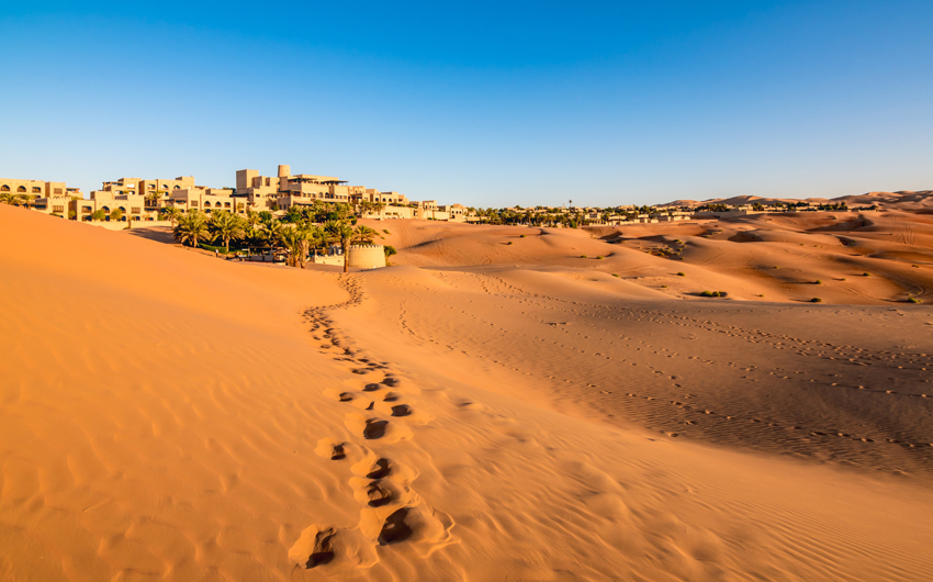 Footprints on desert sand in Abu Dhabi