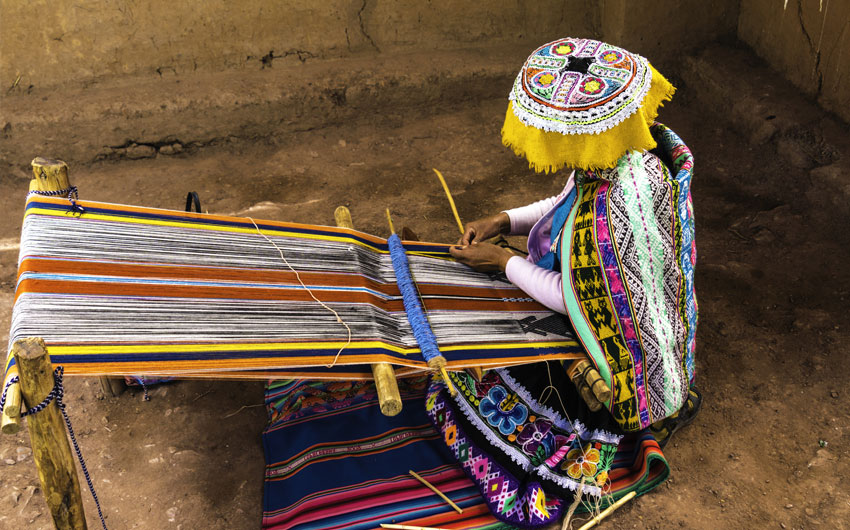Inca woman weaving alpaca wool, Peru