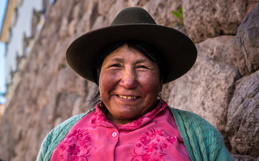 Peruvian woman at Inca ruins