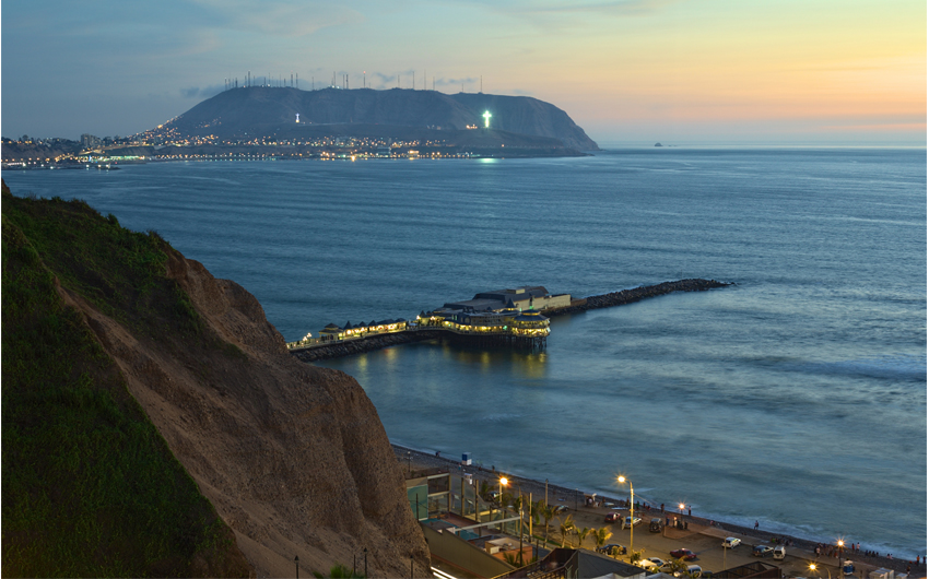 The coastline of Lima, Peru at twilight with the Restaurant La Rosa Nautica