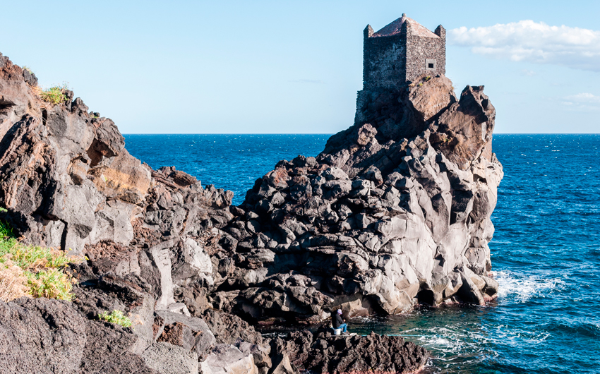 Watchtower on a lava cliff near Acireale