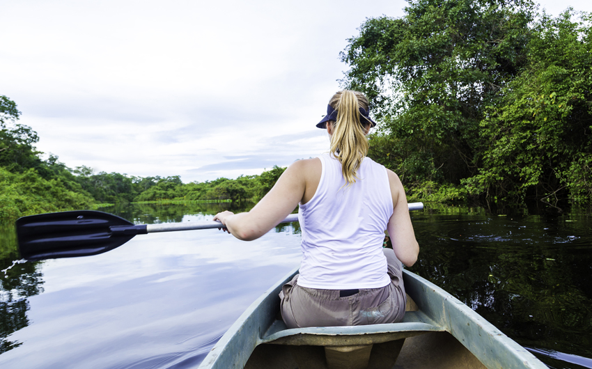 Riding a canoe in Pantanal River